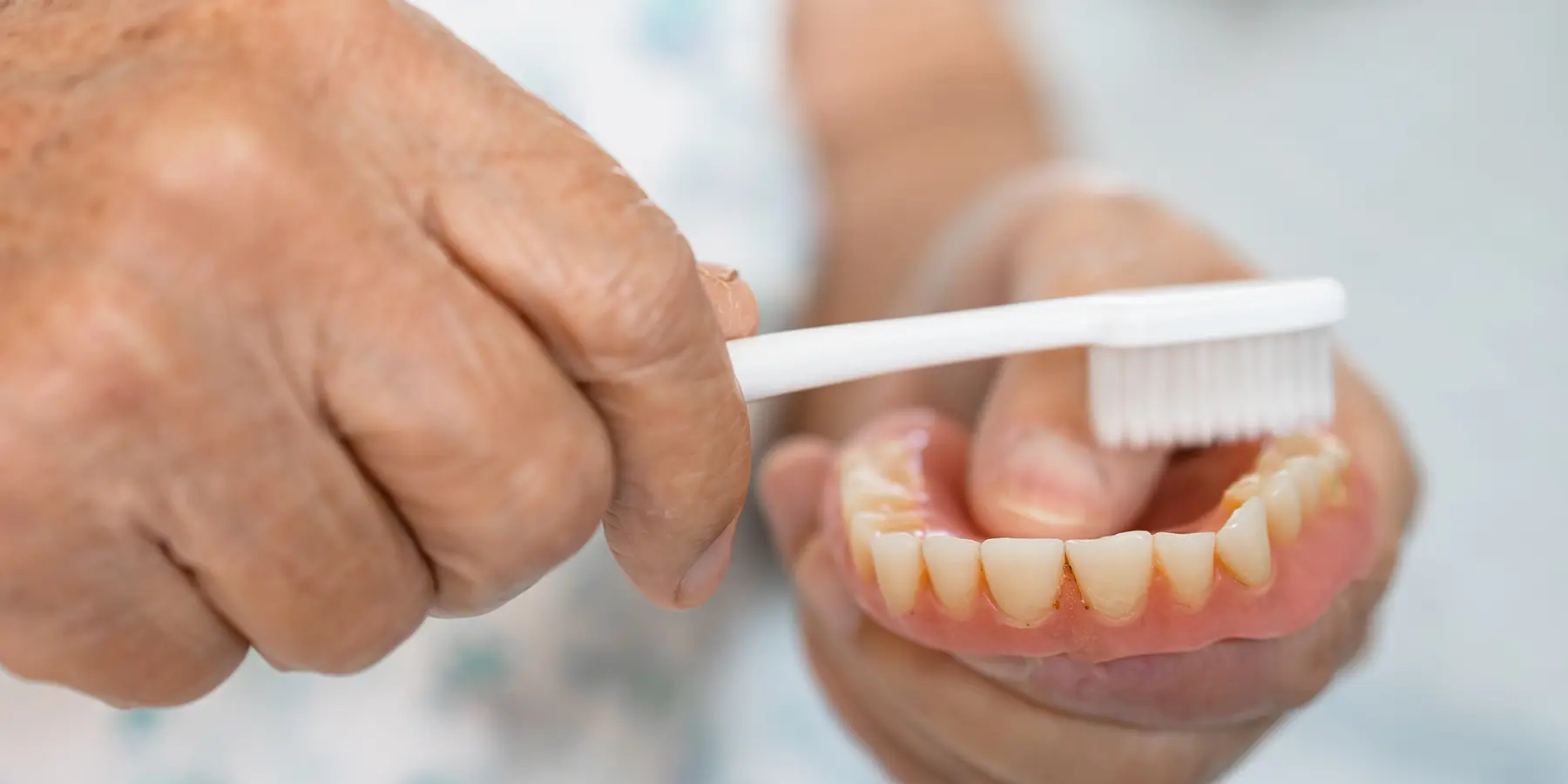 How to Clean Implant Dentures and Care for Them Properly